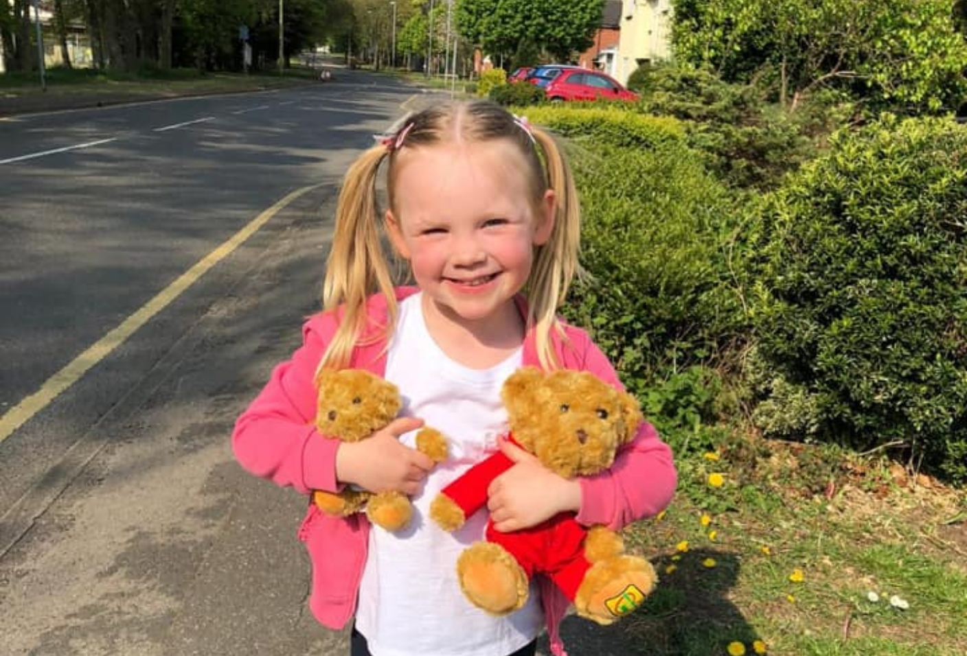 Ella holding LNAA teddies