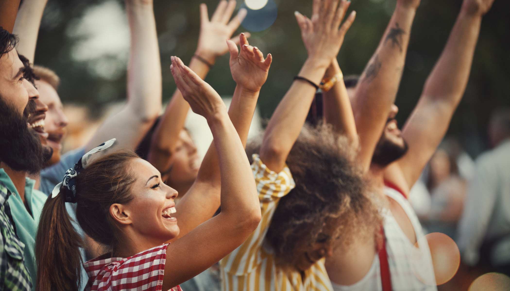 Crowd of people cheering at an event