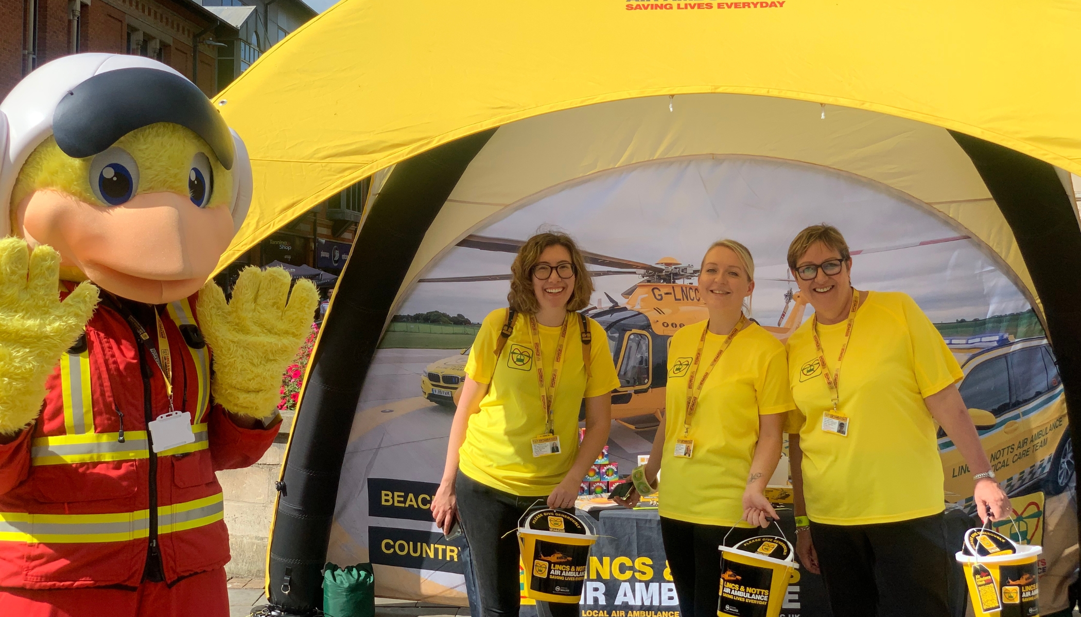 Fundraisers with mascot paramedic duck