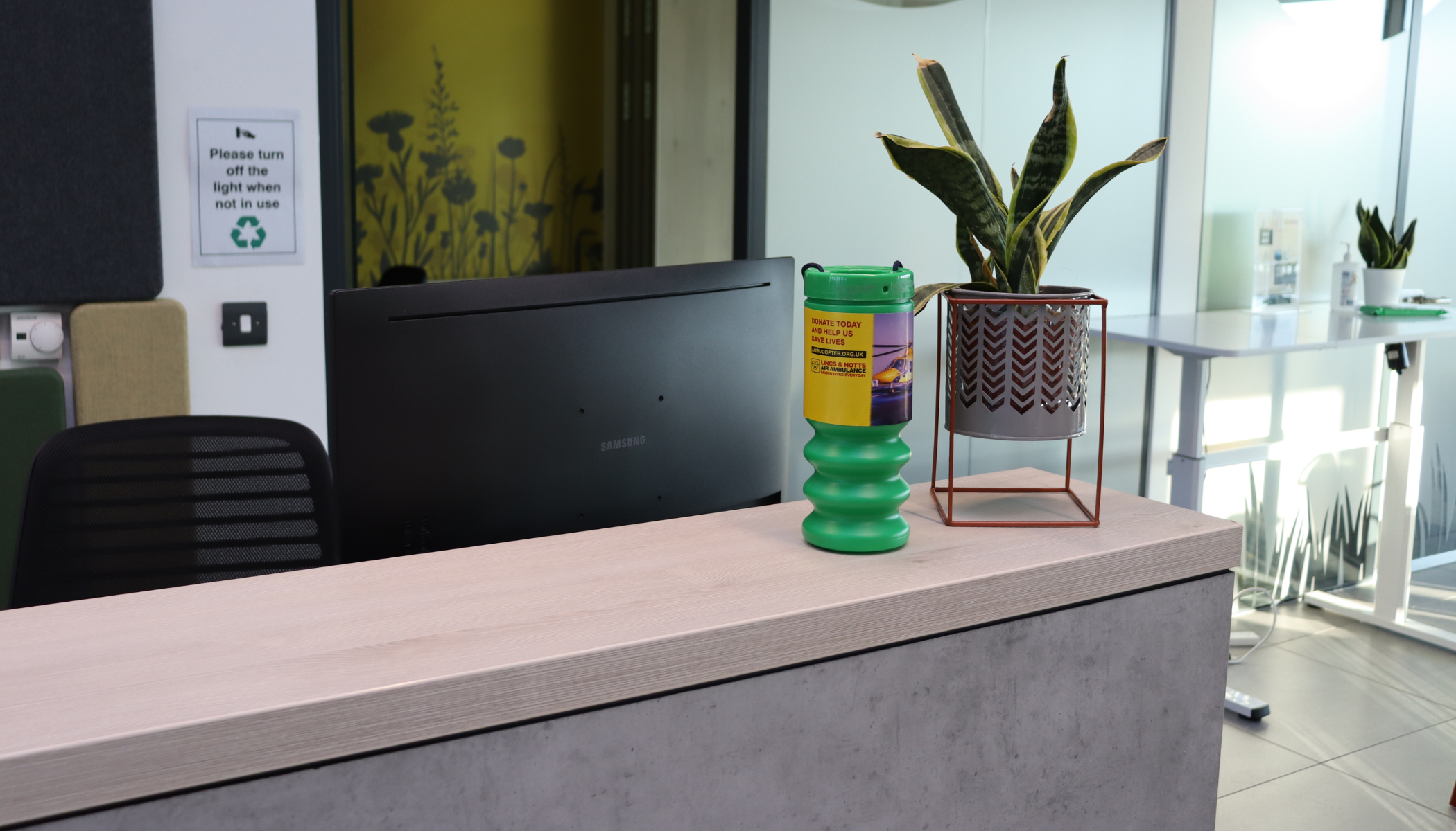 Collection tin on a reception desk