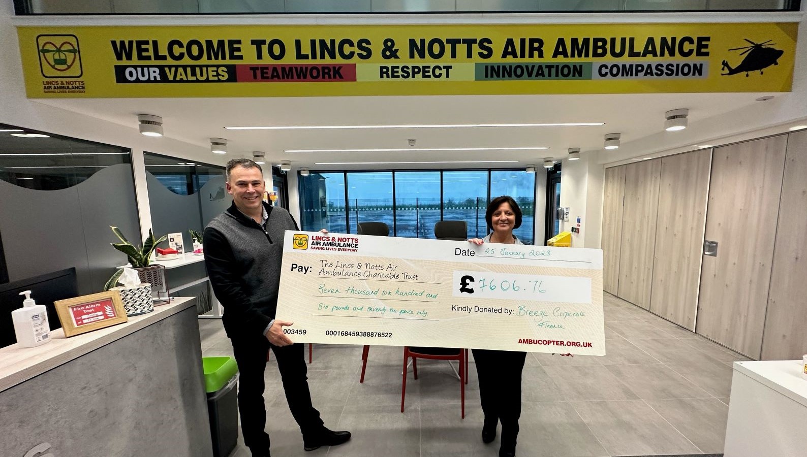 Breeze corporate finance giving cheque to Lincs & Notts Air Ambulance