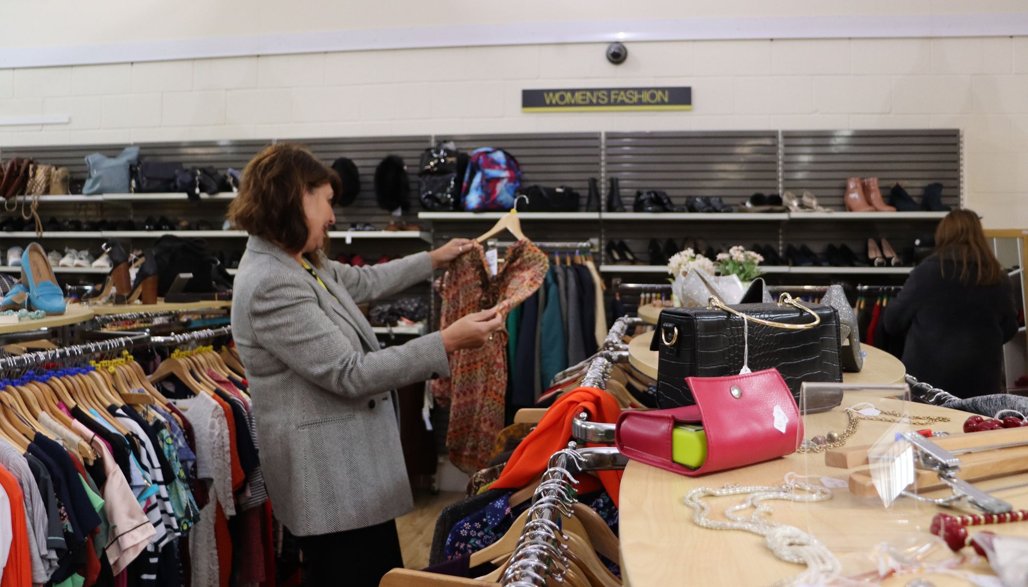 Customer looking at items in our charity shops