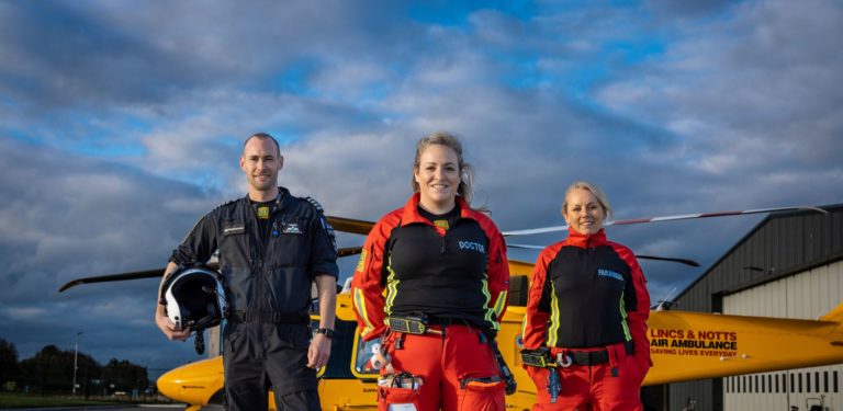 Our crew stood in front of the helicopter