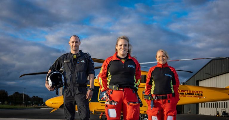 LNAA crew in front of helicopter