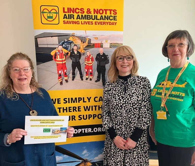 Paula Kirtland giving a cheque to LNAA