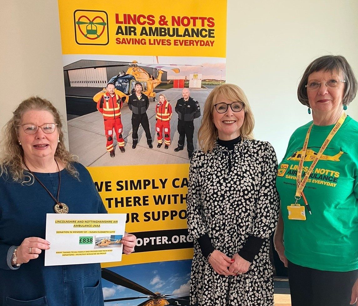 Paula Kirtland giving a cheque to LNAA