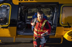 Doctor walking out of helicopter