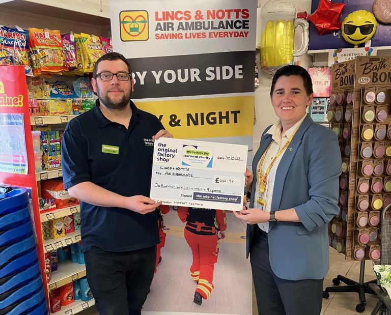 Origianl Factory Shop manager giving LNAA donations