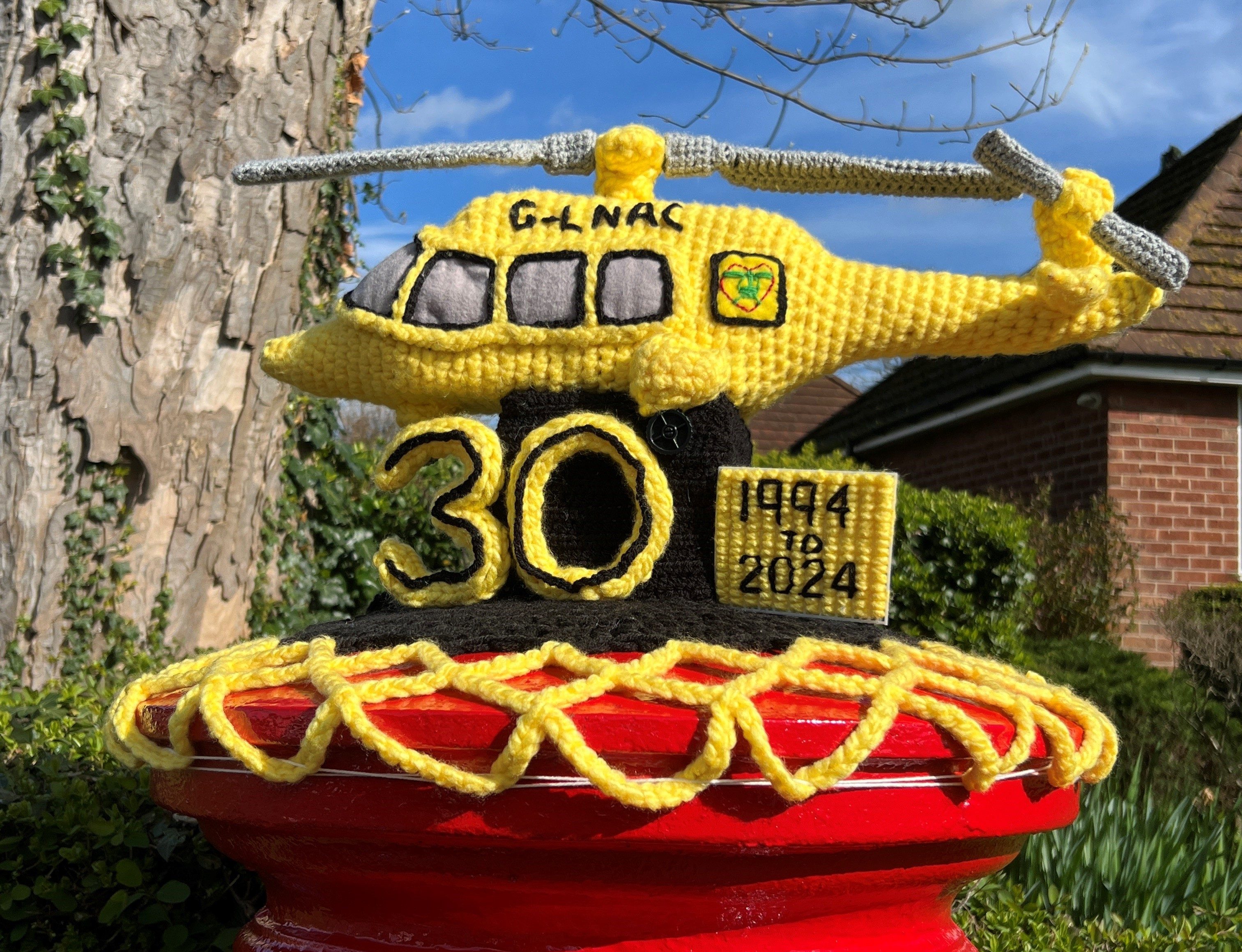 knitted helicopter on post box