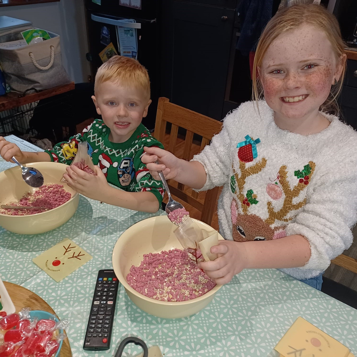 Children creating Christmas treats to sell