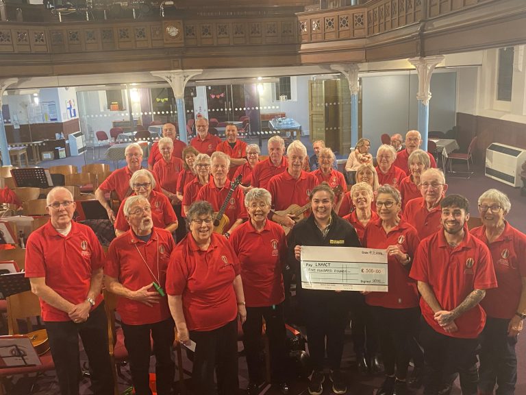 spalding ukelele group giving a cheque to LNAA