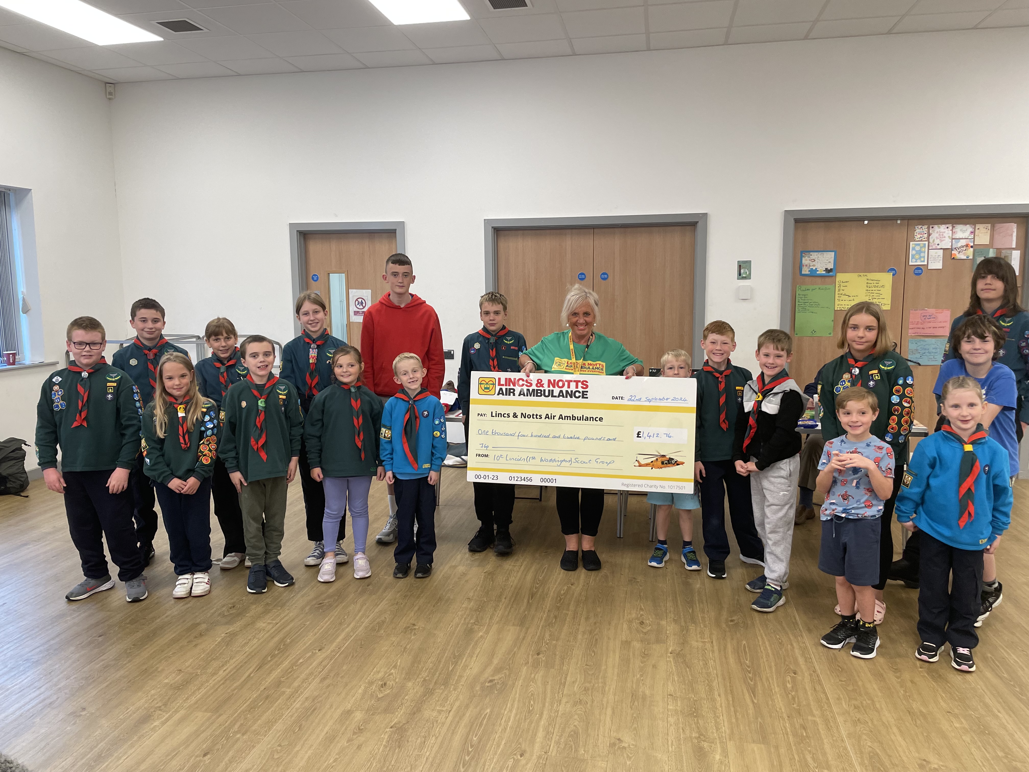 scouts with a cheque for LNAA