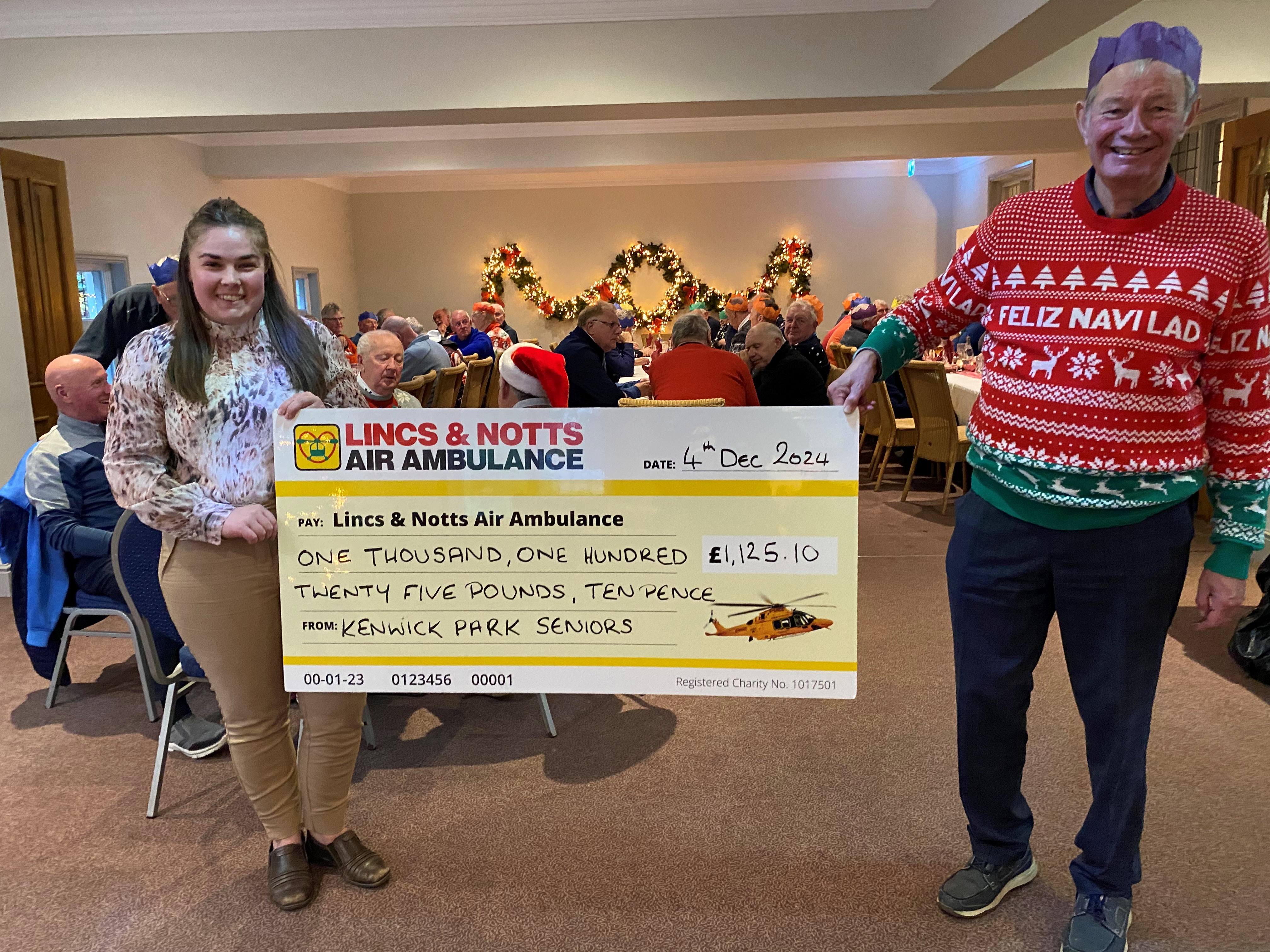 Kenwick Park Seniors giving LNAA cheque