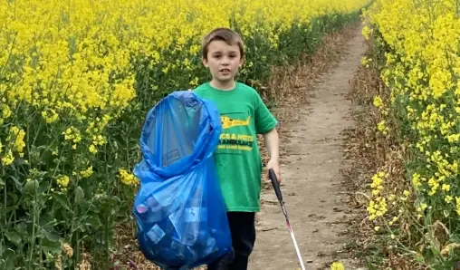 Fundraiser collecting litter